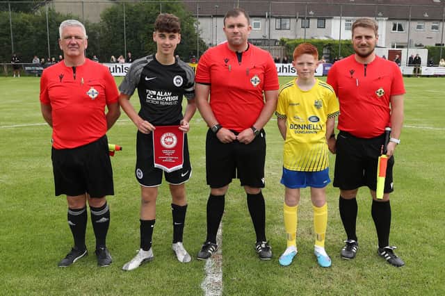 Match officials and team representatives before the kick-off for the Boys Minor game between Dungannon United Youth and Larne on Monday at Broughshane.