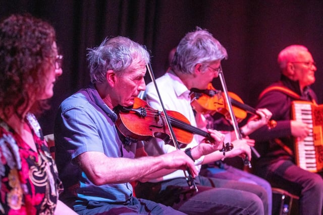 Donal O’Donnell from Comhaltas Ghlinntí Aontroma alongside some of the tutors involved in the Shared Music of Dalriada performance.