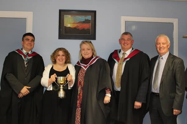 Principal James Maxwell (left) and staff before the prize night ceremony.