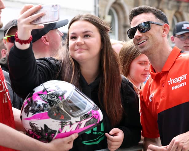 Briggs Equipment North West 200 star, Glenn Irwin stops for a photo with fans at the 'Meet the Riders' day.