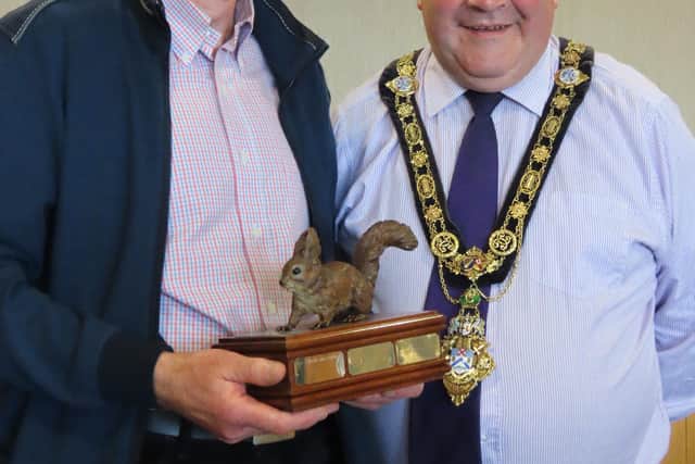 Gerard McCaughan, with his Volunteer of the Year award received from the Red Squirrel Survival Trust, pictured with the Mayor of Causeway Coast and Glens Borough Council, Councillor Ivor Wallace