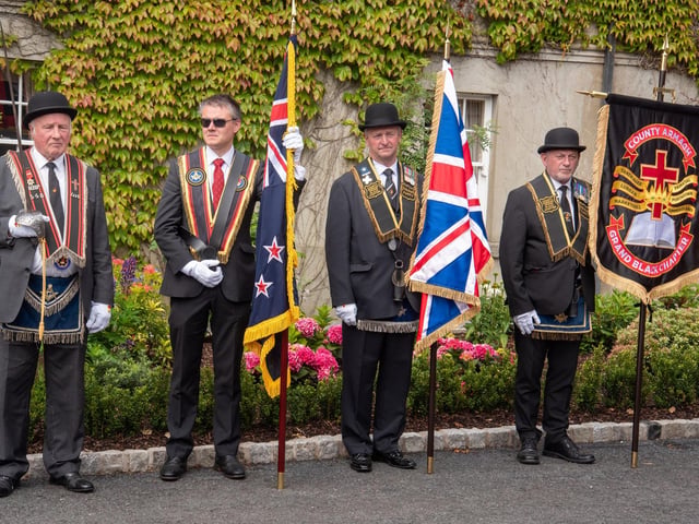 County Armagh RBP officers watch as the parade passes at Scarvagh House on Saturday. TH 106.