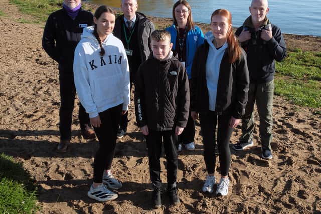 Students Aidan, Catrin and Emma of Holy Trinity College, are pictured with Gerry Darby, Lough Neagh Partnership; Mr Stevenson, Holy Trinity College; Amy Smyth, Henry Brothers and Gary McErlain, Lough Neagh Partnership; during a visit to Lough Neagh as part of a pilot schools engagement programme which was successfully delivered by Lough Neagh Partnership and involved The Henry Group of Companies in Magherafelt. Credit: Supplied