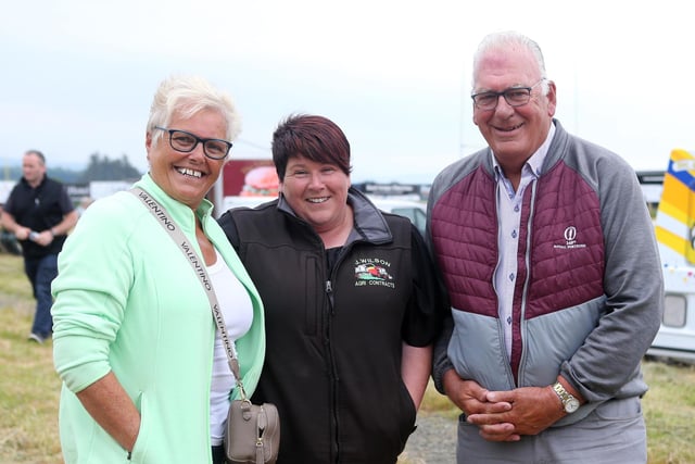 Sandra Stirling, Tracey Wilson and Bill Kennedy pictured at the John Cusick Memorial tractor run in Armoy on Saturday with all proceeds going the the Castle Tower School CREDIT MCAULEY MULTIMEDIA