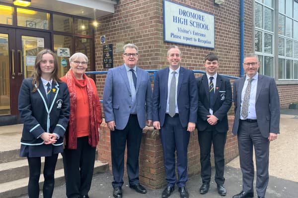 Education Minister Paul Givan with Principal Ian McConaghy, members of the Board of Governors, Head Girl and Head Boy, during a visit to Dromore High School.