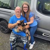 Jimmy and Julie Thornton, with an adorable German shepherd pup recently rescued by 'Paws and People'.