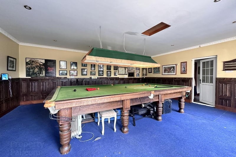 Games room with twin set of French doors and ½ wall decorative panel.