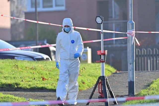 Investigators at the scene of the murder in the Edward Street area of Lurgan. Picture: Pacemaker
