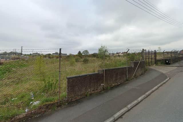 The Lurgan site where the townhouses are going to be built is a large vacant plot currently overgrown. Credit: Google