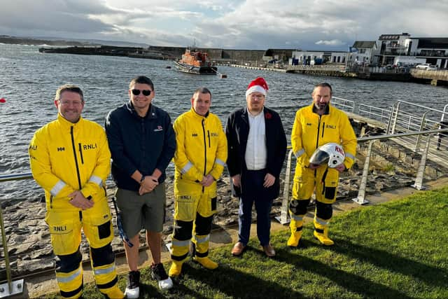 Causeway Alliance Alderman Richard Stewart with members of Portrush RNLI. Credit Richard Stewart