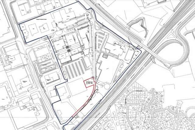 A site map with the area of proposed development outlined in red.