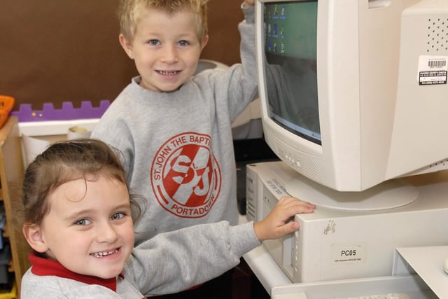 Getting their computer skill up to scratch during their first days at St John the Baptist Primary School in 2007 are new P1 pupils Andrew Wilson and Eva Lambe.
