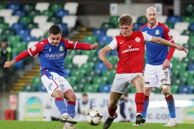 Linfield’s Jordan Stewart with Larne’s Dylan Sloan during Monday evening's match at Windsor Park. Picture: Jonathan Porter / Press Eye