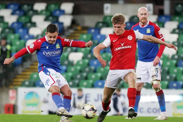 Linfield’s Jordan Stewart with Larne’s Dylan Sloan during Monday evening's match at Windsor Park. Picture: Jonathan Porter / Press Eye