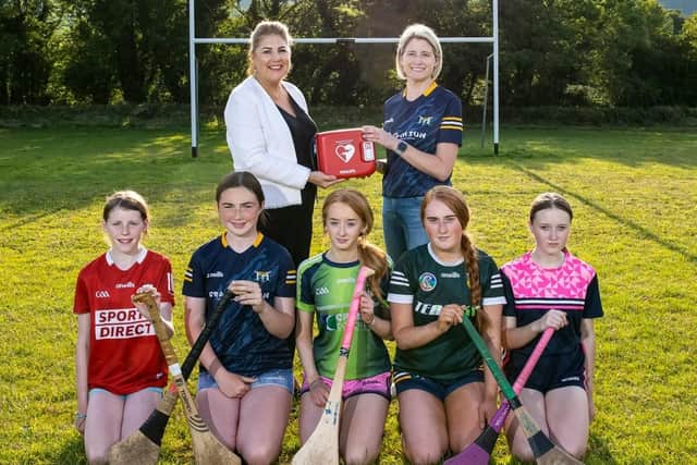 Belfast City Airport donates vital defibrillator equipment to St John’s Camogie Club in Carnlough, in memory of former youth player and local resident, Maggie Black, who sadly passed away at the age of five. There to celebrate the installation was Sheenagh Black, Maggie’s mother (back right) alongside Belfast City Airport’s Director of Corporate Services, Michelle Hatfield (back left) and members of St John’s Camogie Club’s youth sector – Eimear Black (Maggie’s sister), Ciara McCloughlin, Aoife Campbell, Aoife Murphy and Ellie McGarel.  Photo: John Reynolds, Image Perfect Film and Photography/Belfast City Airport