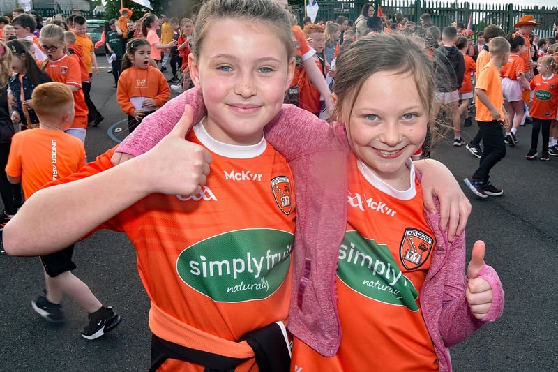 Two pupils showing their support during Armagh Day on Friday. P19-213.