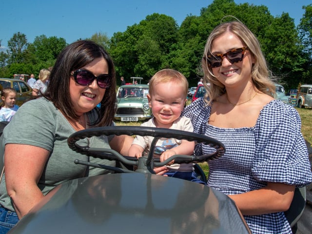 The vintage tractors on display at the Drumcree Parish Garden Fete were a big attraction on Saturday. Pictured having a go are three generations including from left, Tina Dunwoody, nanna, Nate Brown (1) and Sophie Dunwoody. PT23-230.
