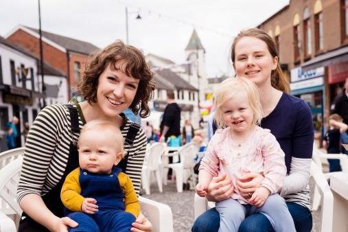 Corrie with Eoin and Catherine with Phoebe enjoying the Coronation Street Party.