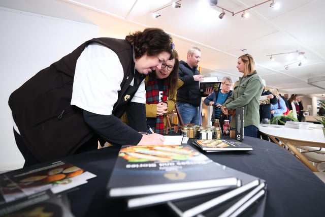 Paula McIntyre signs copies of her Taste Causeway book ‘Recipes and Stories’.