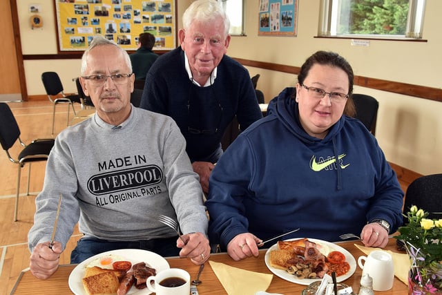 Tucking in at the Loughgall Parish Big Breakfast are from left, Terry Chin, Davy Calvin and Joanne Chin. PT13-204.