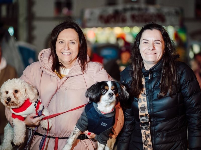 Emma and Kristina with dogs Buddy and Freddie.
