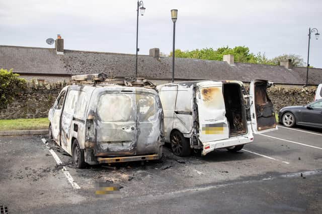 Two burned out vans, including one belonging to the injured man, in the public car park near Dundarave Park, Bushmills.