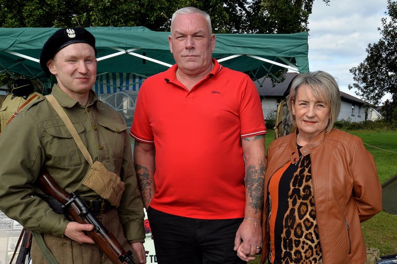 Keith and Denise Thompson pictured with 'Polish soldier', Marcin Szajder at the WWII Fun Day at Brownlow House on Saturday. LM39-204.