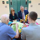 Governor of Maghaberry Prison, David Savage and Julie McConville, Assistant Director for Specialist Child Health and Disability with the Southern Health & Social Care Trust, review the crocheting work of the ‘Stitch in Time Gang’. Picture: Michael Cooper

