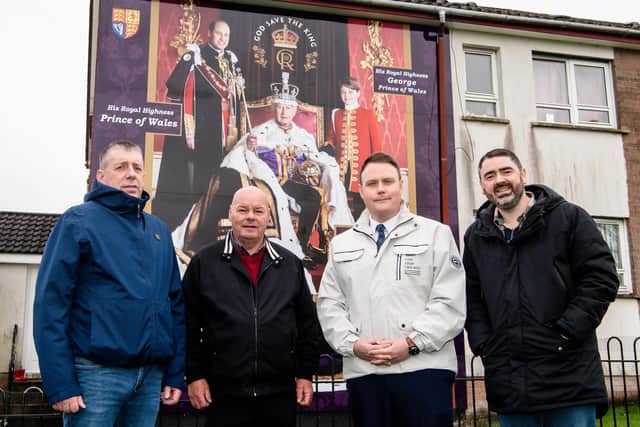 Pictured at the launch of the Devenish Drive mural funded through Housing Executive Cohesion funds with members of Monkstown Community Association are Mayor of Antrim and Newtownabbey, Cllr Mark Cooper and Stephen Gamble, Housing Executive Good Relations Officer, South Antrim. (Pic: Contributed).
