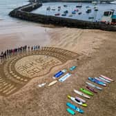 Portrush's West Strand was one of 30 venues around the UK hosting a paddle out protest organised by Surfers Against Sewage on Saturday, May 18.