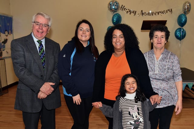 Founder of Epworth Playgroup, Rev Ken Robinson pictured at the  group's 10th anniversary coffee morning with , deputy leader, Stacey Macartney, Ana Rocha, Caranolina Oliveira (5) and Maria Rocha. PT48-243.