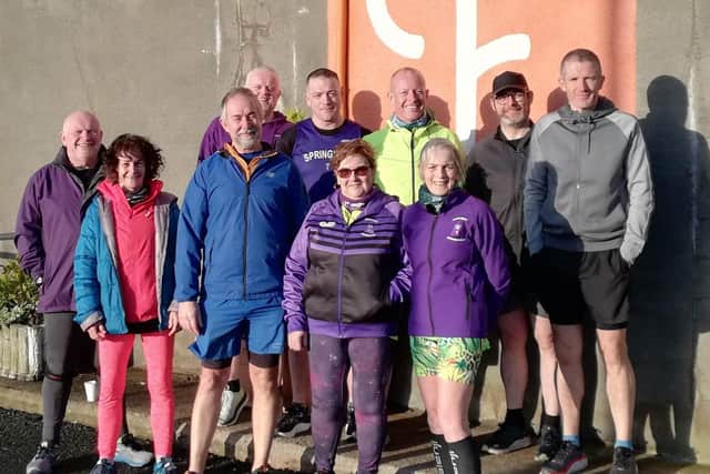 Janet Patrick celebrating her 250th parkrun with fellow members at Lower Drummans parkrun