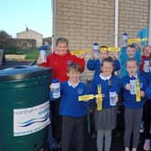 Pupils from Harpur's Hill PS pictured with the waterbutt and the yellow tags