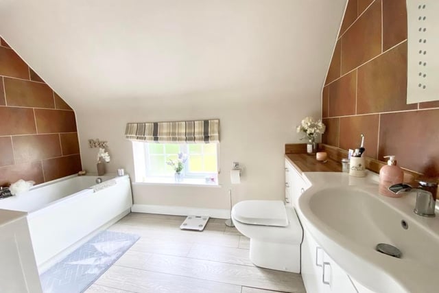 The master bedroom ensuite has been refitted with modern bath, hand basin and wc.