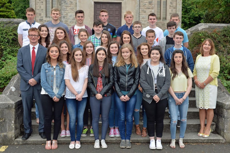 St Killians College vice-principal, Mrs Eileen McKay (right) and Mr Padraig McIlwaine (left) are pictured with a group of top GCSE achievers in 2015. INLT 34-018-PSB