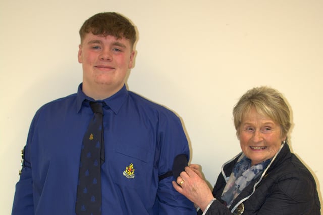 Harry Speers receiving his President's Badge from his granny Mrs Eithna Crawford