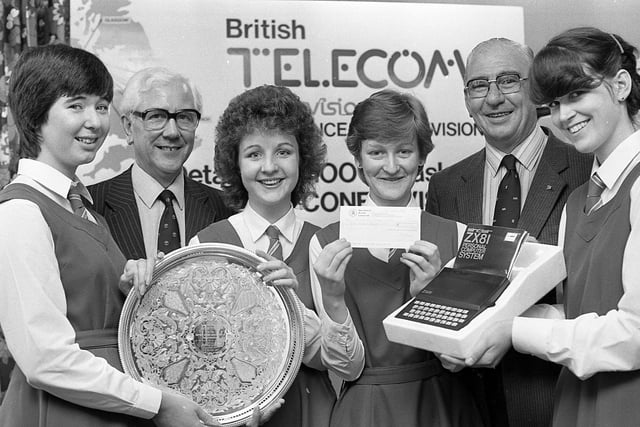 Four Ballynahinch pupils beat off sixth form opposition in Manchester and impressed experts in Glasgow to win the British Institute of Management-Information Technology 1982 schools competition - without even leaving Northern Ireland. The Convent of the Assumption Grammar School, Ballynahinch team, Brenda Cavanagh, left, Carmel O’Reilly, Martina Dunlop and Ursula O’Neill are pictured receiving their prizes in September 1982 from Mr Brian Millar, second left, British Telecom planning services controller and Mr Archie McCulloch, chairman (Northern Ireland) British Institute of Management. British Telecom had setup a three-way telecommunications “miracle” to stage the United Kingdom finals of the schools competition. The transmission, from Churchill House, Belfast, inaugurated British Telecom’s Confravision system. 
Picture: News Letter archives
