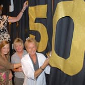 Adding the final touches to the backdrop for the  Larne High School and St Comgall's College joint 50th anniversary concert were Andrea McCullough, Irene Bowyer, Anne Browne and June Beattie. LT22-384-PR