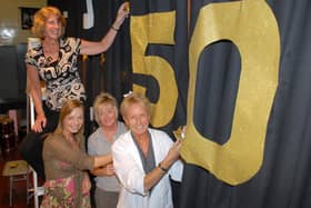 Adding the final touches to the backdrop for the  Larne High School and St Comgall's College joint 50th anniversary concert were Andrea McCullough, Irene Bowyer, Anne Browne and June Beattie. LT22-384-PR