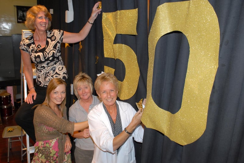 Adding the final touches to the backdrop for the Larne High School and St Comgall's College joint 50th anniversary concert were Andrea McCullough, Irene Bowyer, Anne Browne and June Beattie. LT22-384-PR