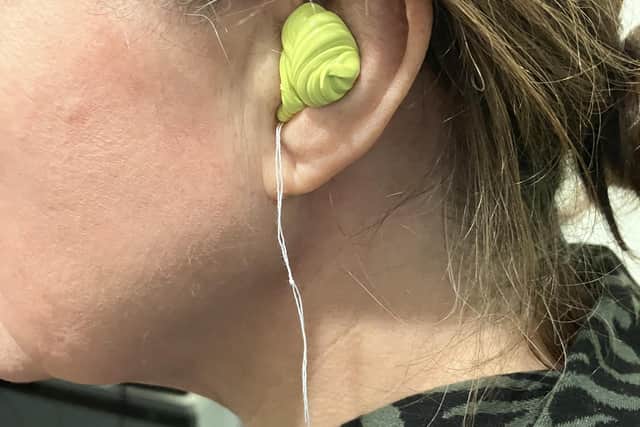 The audiologist seals off my ear with 'putty' totally closing off any sound