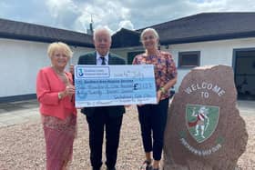 Eilish and Colum McKeever presenting the cheque for £2,127 to Southern Area Hospice CEO  Liz Cuddy. Picture: Southern Area Hospice.