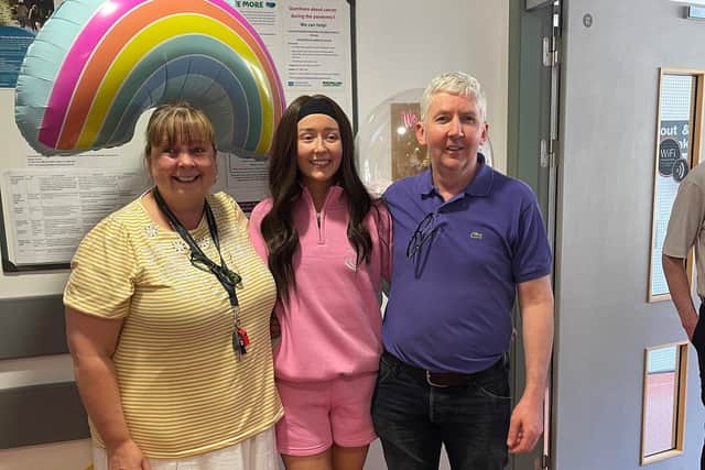 Abbie with her mum and dad at end of chemo in hospital. Pic credit:  Teenage Cancer Trust