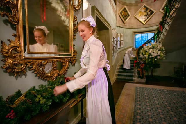 Explainers dress the Staircase Hall at Hillsborough Castle in preparation for a Victorian Christmas.