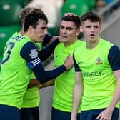 Stephen Teggart (second right) celebrates scoring for Glenavon against Linfield at Windsor Park last year. He’s now on loan at Armagh City.