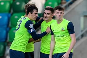 Stephen Teggart (second right) celebrates scoring for Glenavon against Linfield at Windsor Park last year. He’s now on loan at Armagh City.