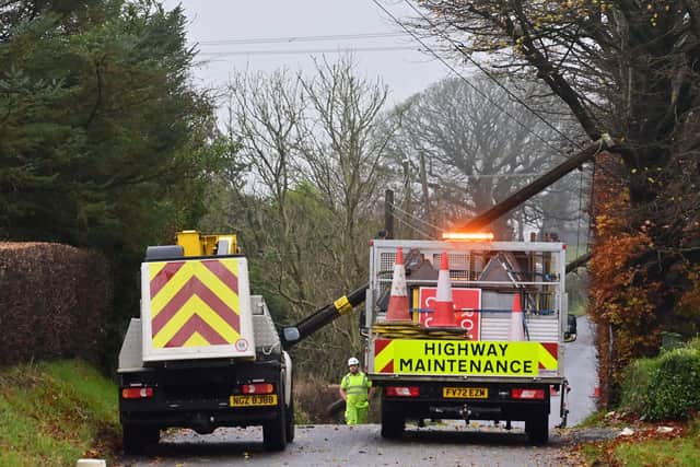 Electric poles blocking the road on the  Loughmourne Road in Co Antrim on Monday. Picture: Colm Lenaghan / Pacemaker