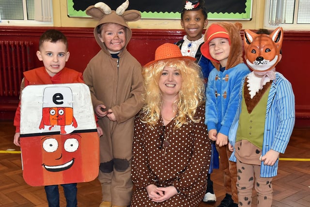 Primary 1 teacher at Presentation Primary School, Mrs Laura Haddock pictured with some of her pupils who dressed up for World Book Day. PT10-203.