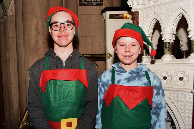 Brothers, Andrew, left, and Adam Walker who were playing Santa's elves at the St Mark's Parish Church craft fair and Santa's Grotto In The Tower. PT50-213.