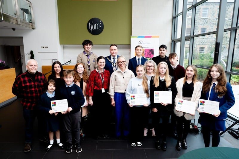 Mayor of Antrim and Newtownabbey, Councillor Mark Cooper BEM and chair of the bursary panel, Harriett Roberts are pictured with the shortlisted schools and individuals for the Mrs Joan Christie CVO OBE Legacy Bursary Awards.